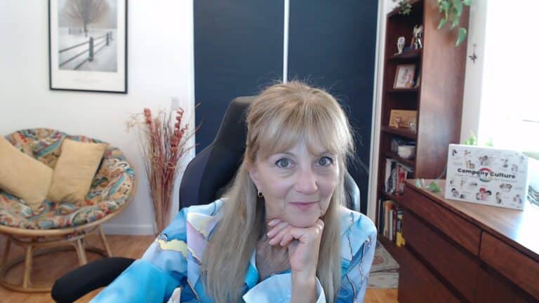 Stephanie sitting at her desk.